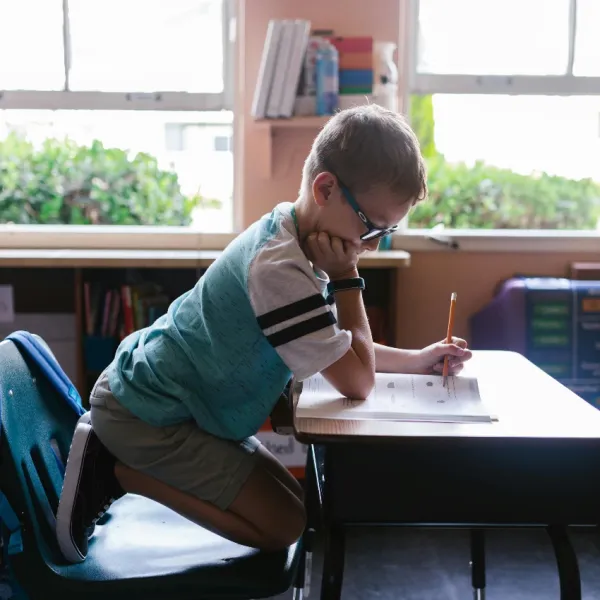 kid learning math at school who learned the basics at home
