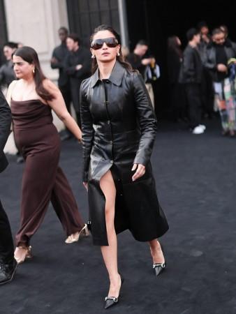 Alia Bhatt serves fashion goals in a shimmering black leather car coat featuring a tailored silhouette