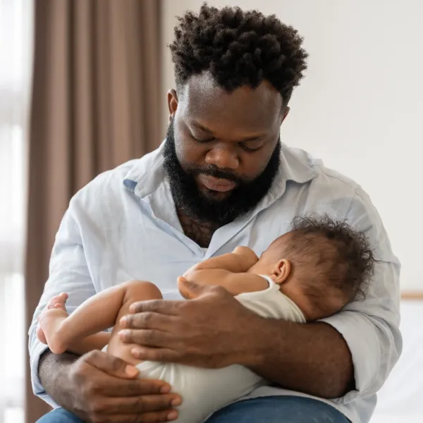father holding baby more reliant on baby monitors