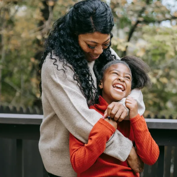 daughter who is happy because she feels loved by her mom