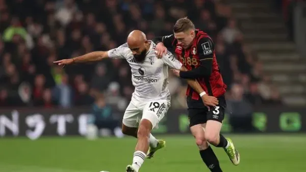 BOURNEMOUTH, ENGLAND - MARCH 20: Bryan Mbeumo of Manchester United is challenged by Adrien Truffert of AFC Bournemouth during the Premier League match between Bournemouth and Manchester United at Vitality Stadium on March 20, 2026 in Bournemouth, England. (Photo by Warren Little/Getty Images)