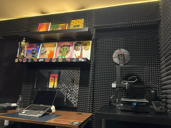 A 3D printer sits above the workstation, allowing residents  to prototype and build hardware alongside their software projects.
