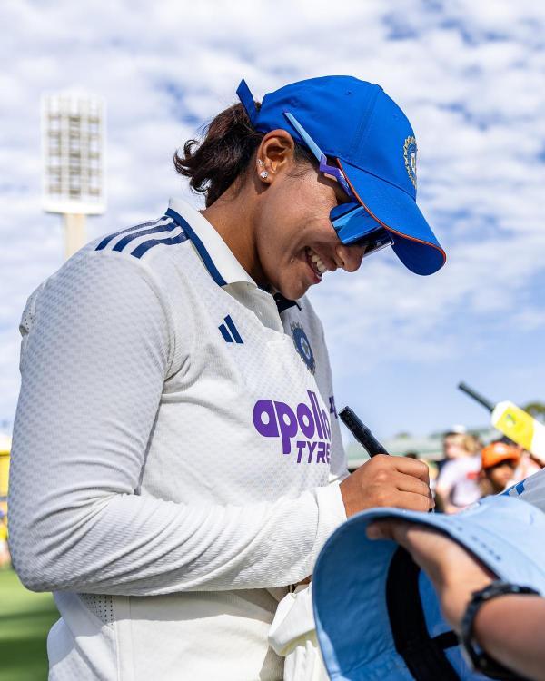 Sneh Rana signs autographs during Day 3 of the Test match between Australia and India earlier this month.