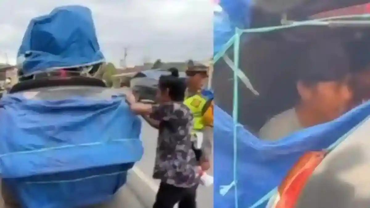 ANGKUT ORANG - Mobil MPV mengangkut hingga 12 penumpang, bahkan sebagian ditempatkan di bagasi terbuka yang hanya ditutup terpal, tanpa pengaman. Ternyata kondisi ini bisa dikenakan hukuman berat.