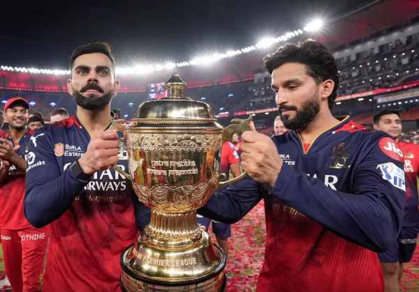Virat Kohli and Rajat Patidar lift the IPL trophy