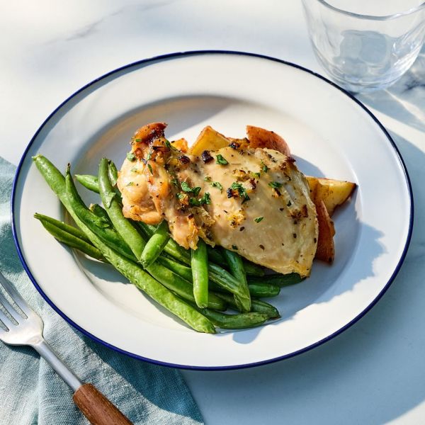 Recipe image of Sheet-Pan Mojo Chicken with Green Beans & Red Potatoes Credit: Photographer: Jake Sternquist, Food Stylist: Shannon Goforth, Prop Stylist: Breanna Ghazali.