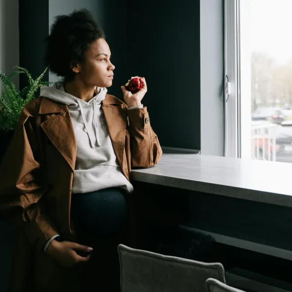 anxious mom looking out hospital window while in labor