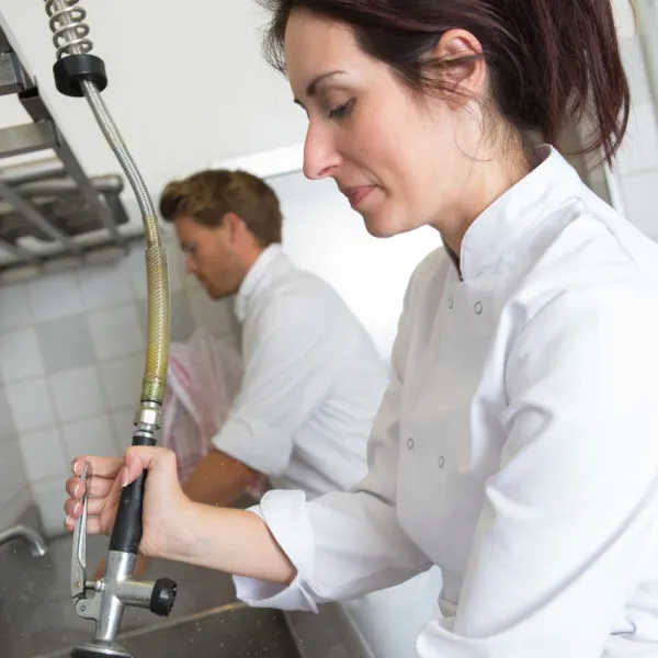 restaurant dishwasher in kitchen