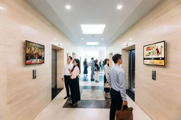 Advertising screens installed an office lobby. Photo courtesy of Chicilon Media