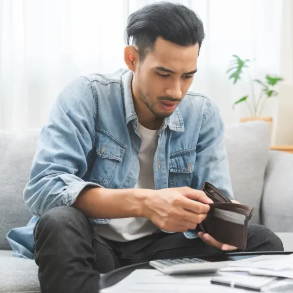 man struggling to afford to have fun because spends all his free time working