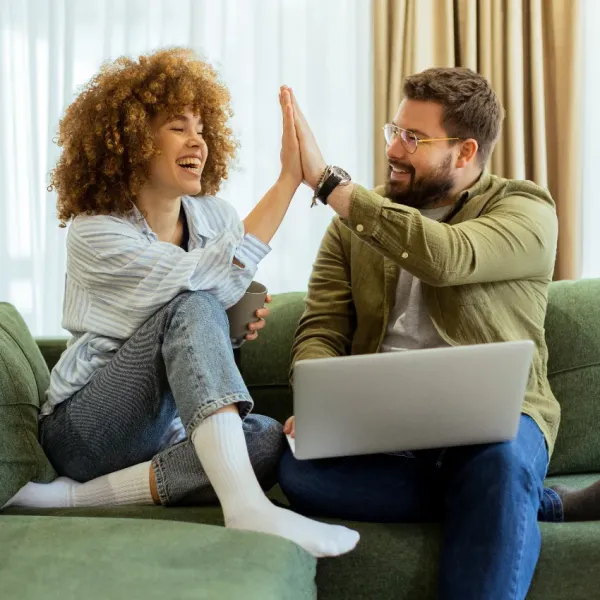 friends giving high five for success