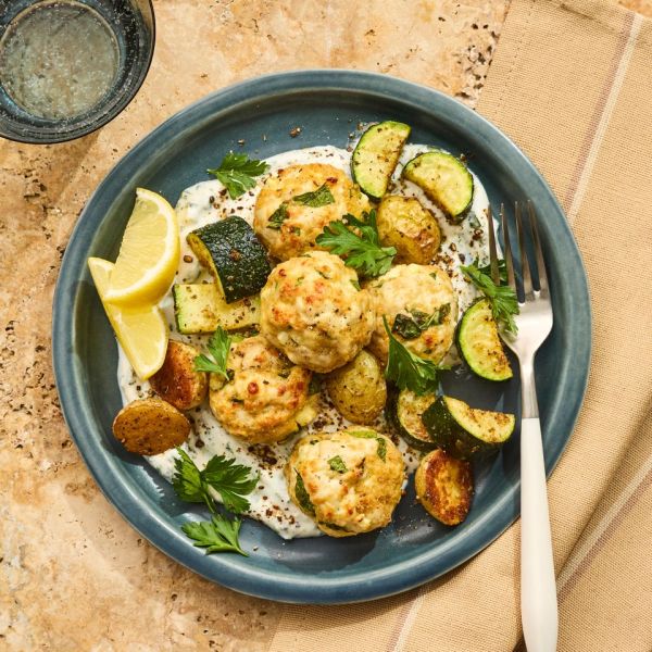 A recipe photo of Sheet-Pan Turkey Meatballs with Zucchini & Potatoes Credit: Photographer Victor Protasio, food stylist Chelsea Zimmer, and prop stylist Hannah Greenwood.