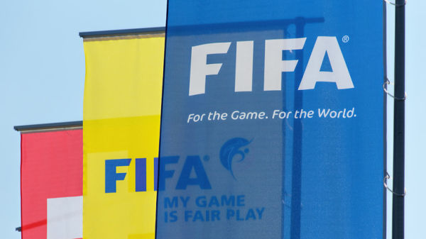 Blue, yellow and red FIFA banners on display