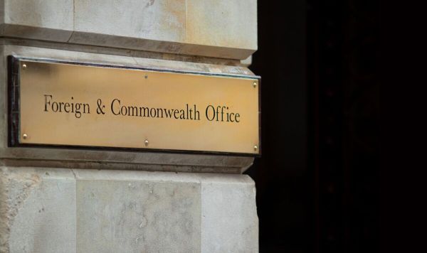 Shiny Foreign & Commonwealth brass plaque outside the offices in Westminster, London with space for copy