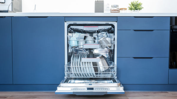 Clean dishwasher in modern kitchen.
