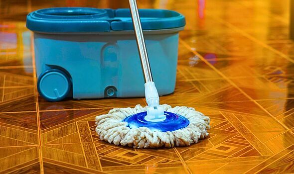 Picture of someone mopping a floor Picture of someone mopping a floor