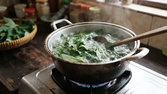 Daun Singkong Cara Membuat Rujak Daun Singkong. (AI Generated)