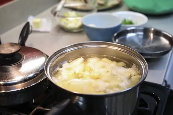 Preparations for making dinner. Boiling potatoes for mashed potatoes for dinner.