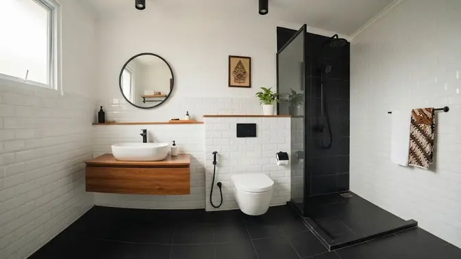 Kombinasi 2 warna keramik polos yang bikin tampilan rumah jadi mewah model putih dan hitam untuk kamar mandi (AI generated)